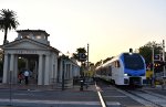 Just before twilight, an eastbound departs the Redlands-Downtown Station 